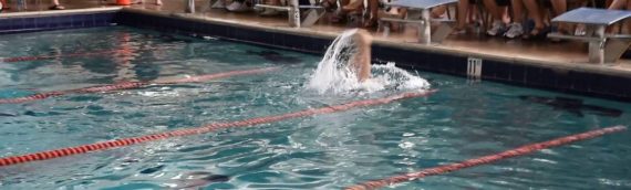 Elise swimming underwater backstroke